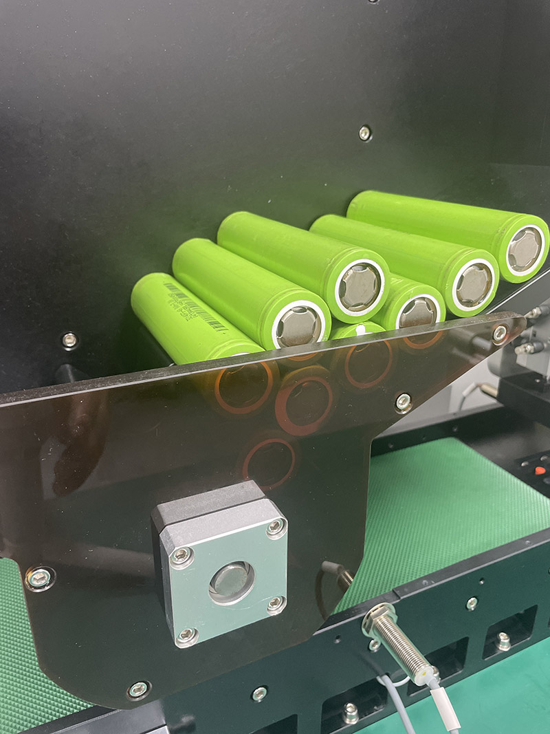 Details of battery sticking machine
